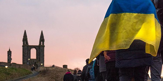 students on pier with ukraine flag