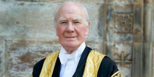 Menzies Campbell looks straight ahead into the camera, he can be seen to be wearing the Chancellor gown of the University Menzies Campbell looks straight ahead into the camera, he can be seen to be wearing the Chancellor gown of the University