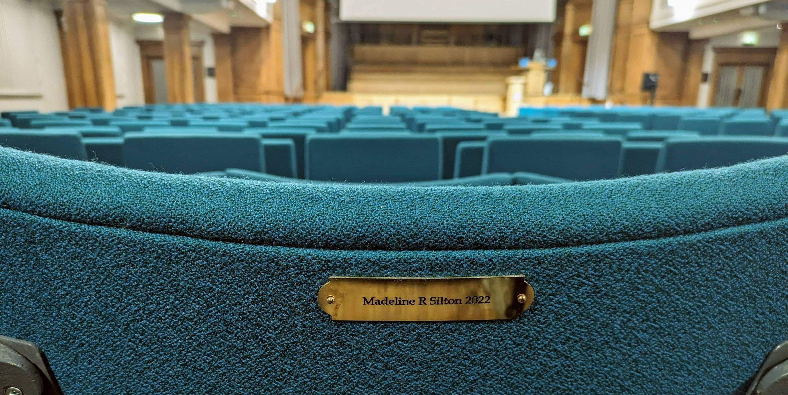 A seat plaque in the Younger Hall