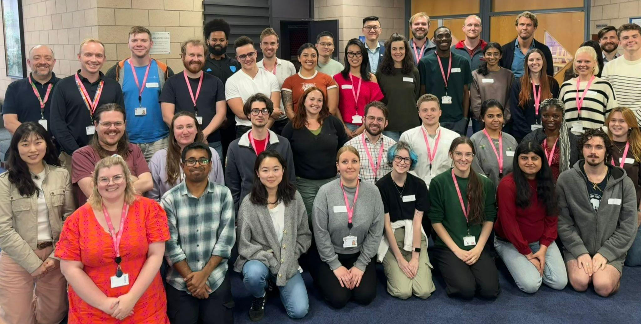 A large group of colleagues are kneeling and standing for a team photo. This is the Halls Life team at the University of St Andrews. A large group of colleagues are kneeling and standing for a team photo. This is the Halls Life team at the University of St Andrews.