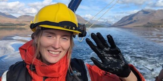 Lauren South, PhD candidate, pictured in protective clothing and helmet on a boat Lauren South, PhD candidate, pictured in protective clothing and helmet on a boat