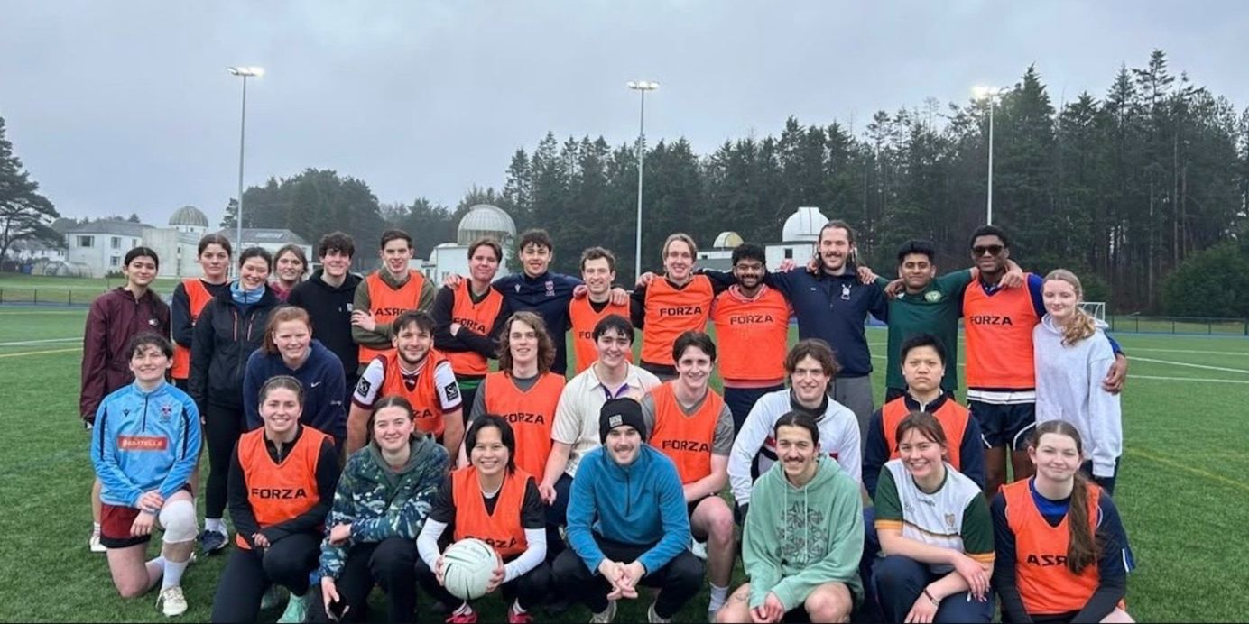 The University of St Andrews Gaelic Football Club pose for a group photo on the field The University of St Andrews Gaelic Football Club pose for a group photo on the field