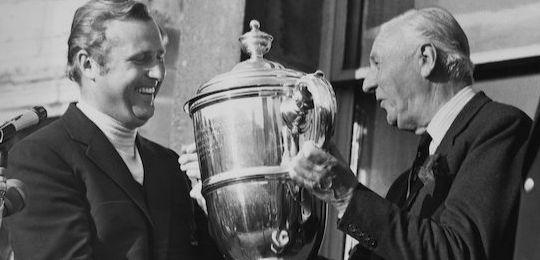 Golfer Sir Michael Bonallack receiving trophy